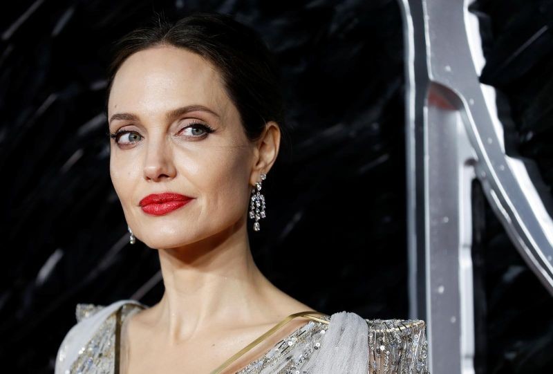 FILE PHOTO: Actor Angelina Jolie poses as she attends the UK premiere of "Maleficent: Mistress of Evil" in London, Britain October 9, 2019. REUTERS/Peter Nicholls